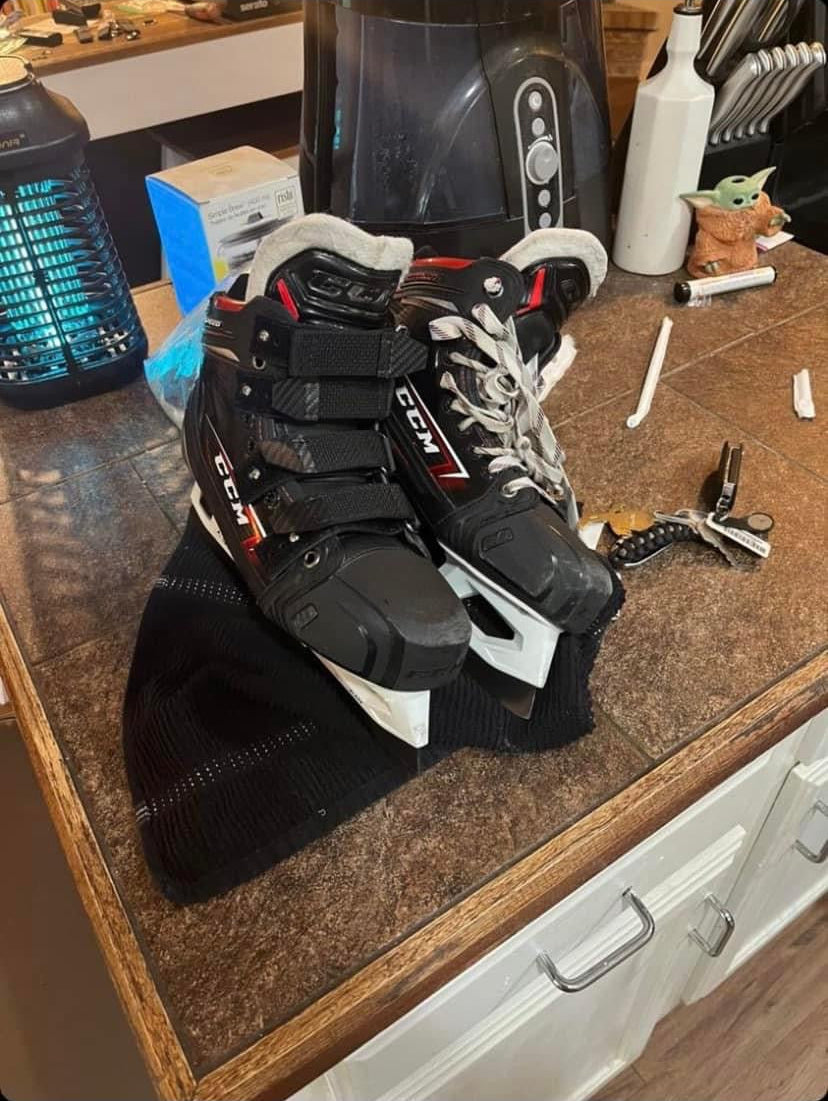 Halo Hockey Laces 2.0 skate strap system installed on one CCM Eflex 6 goalie skate next to a traditionally laces goalie skate