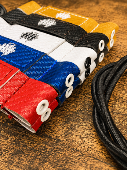 Closeup detail of the reinforcement eyelet on the 5 stock colors of Halo Hockey Posi-Lock goalie toe ties