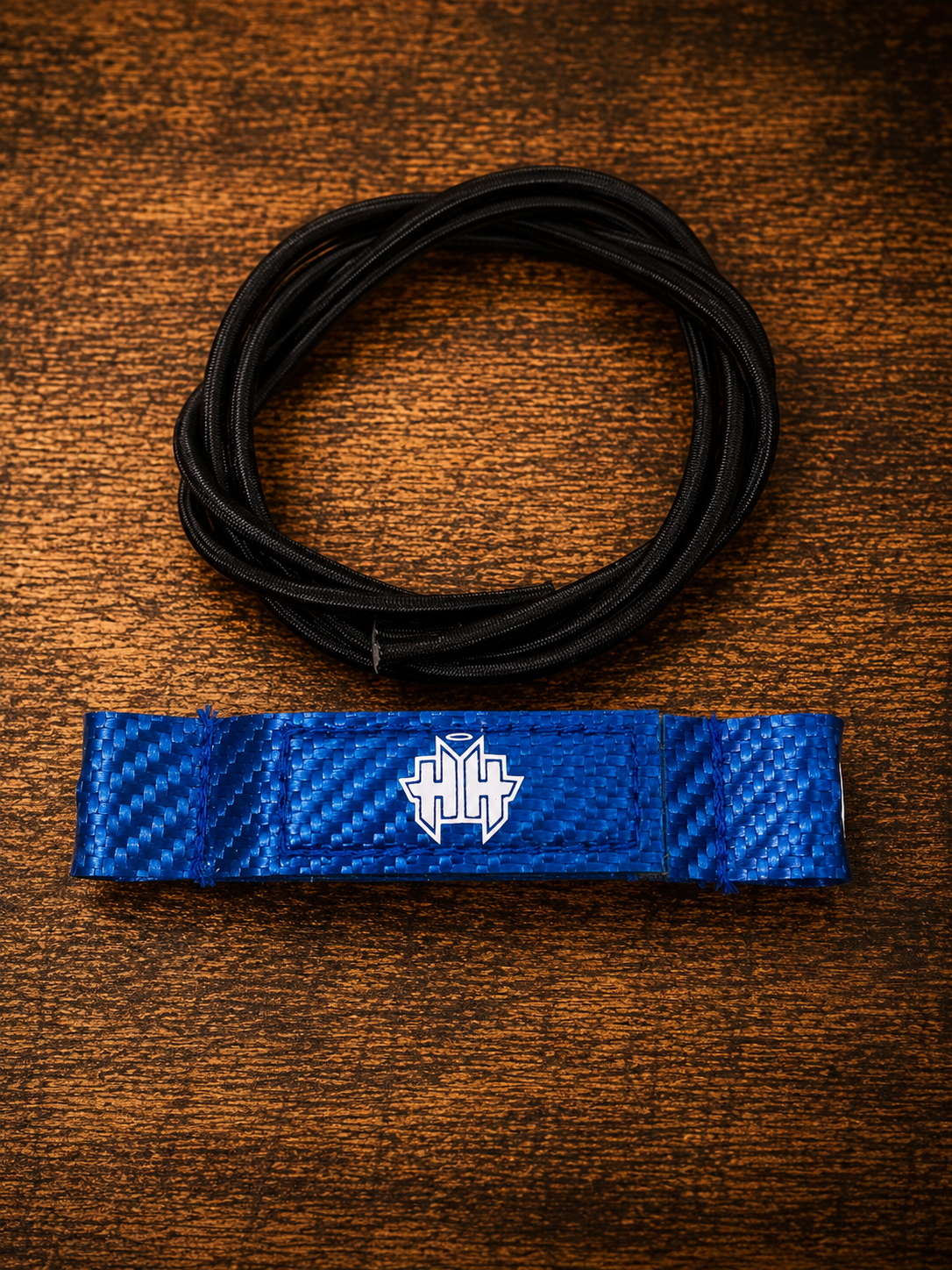 Top kit overview of blue Halo Hockey Posi-Lock goalie toe ties with included shock cord