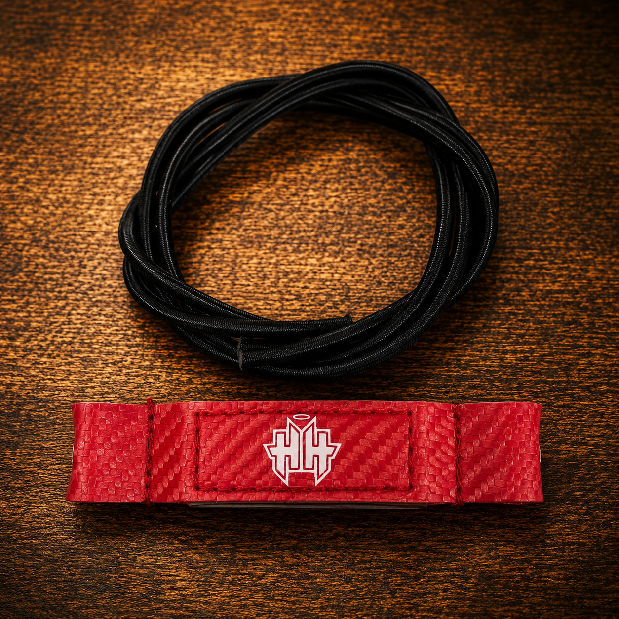 Top kit overview of red Halo Hockey Posi-Lock goalie toe ties with included shock cord
