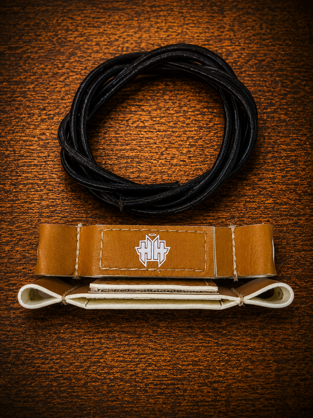 Top and side view of retro tan Halo Hockey Posi-Lock goalie toe ties showing the exclusive sandwich lock design