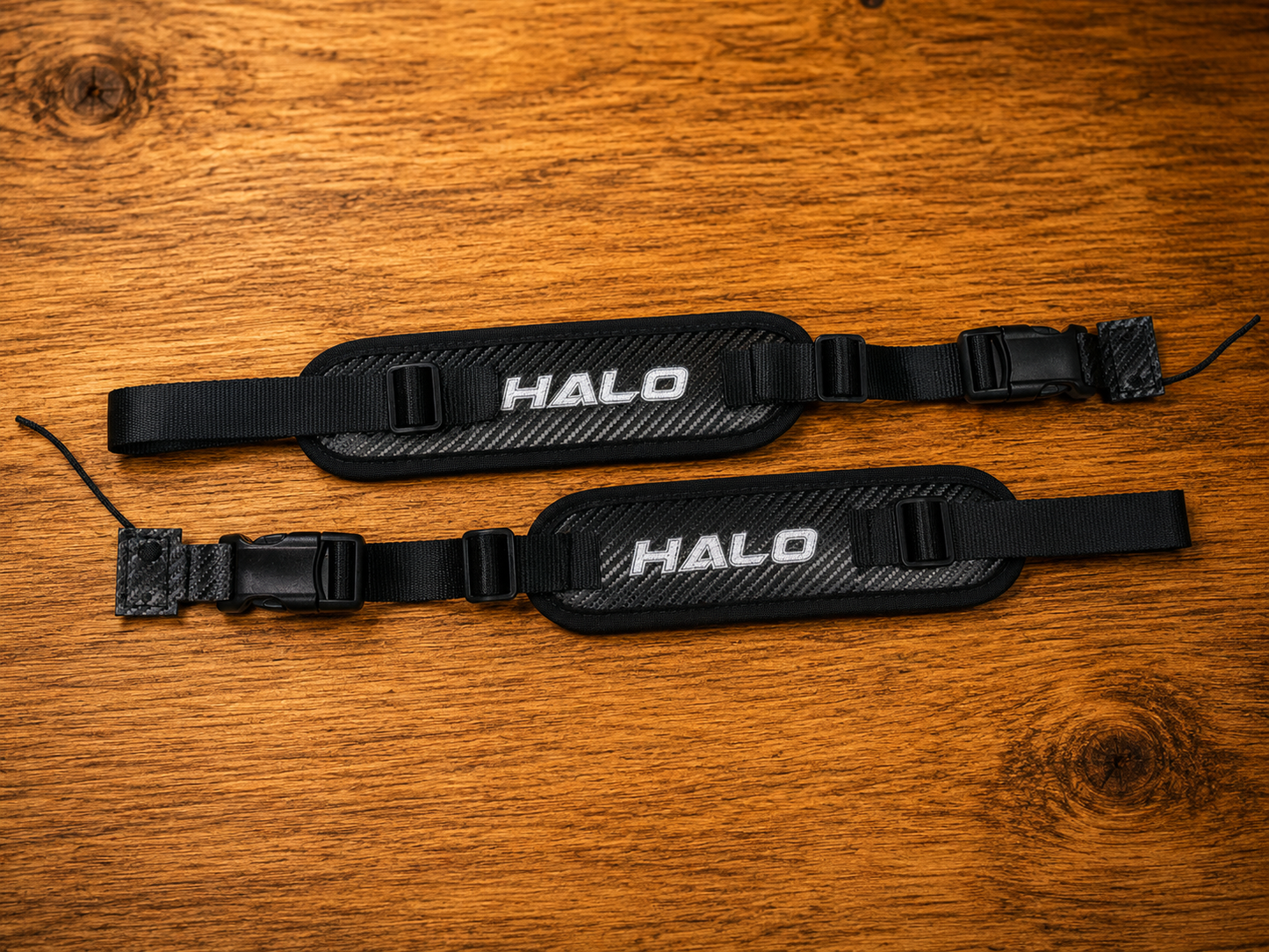Overview shot of black Halo Hockey Rotation Doctor goalie pad straps with tab lacing attachments