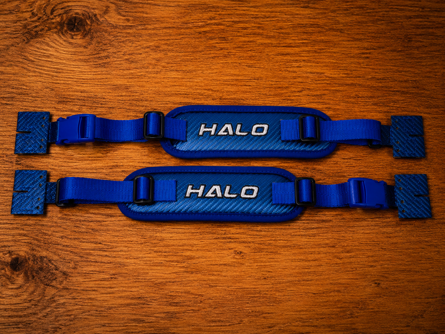 Front side overview of blue Halo Hockey Rotation Doctor goalie pad straps