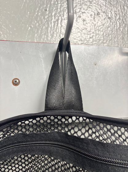 Closeup view of the hang loop on a black Halo Hockey Stinky Boy laundry bag shown hung from a wall hook