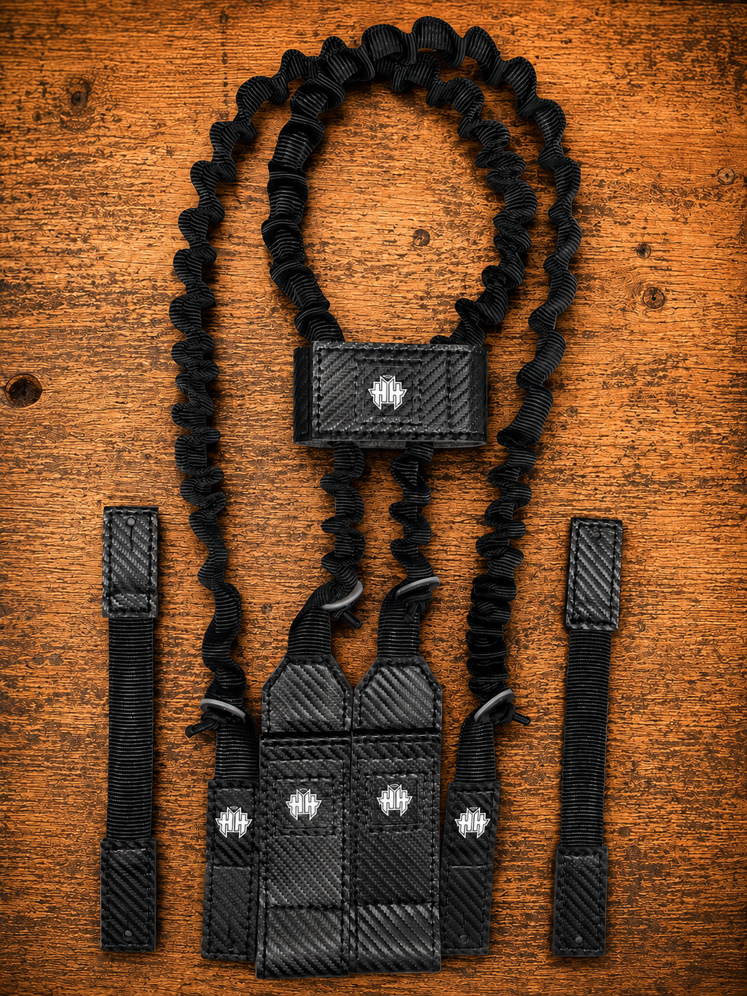 Top kit view of black Halo Hockey Suspenders 2.0 goalie bungee suspenders shown with center strap option