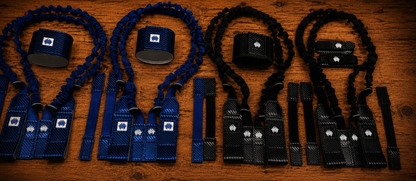 Overview shot of blue and black Halo Hockey Suspenders 2.0 goalie bungee suspenders showing both center strap and shoulder floater attachment options
