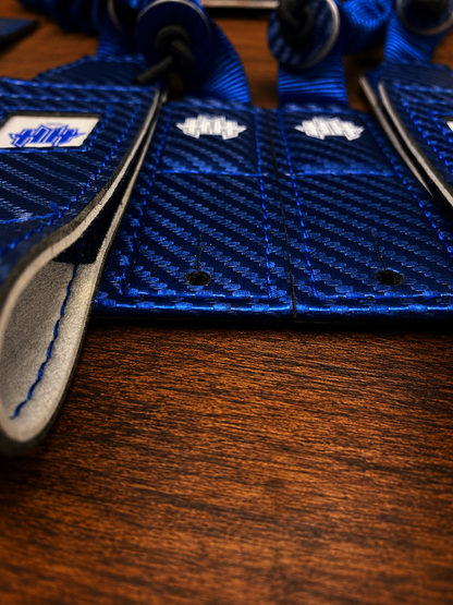 Closeup shot of rear mounting tabs on blue Halo Hockey Suspenders 2.0 bungee goalie suspenders