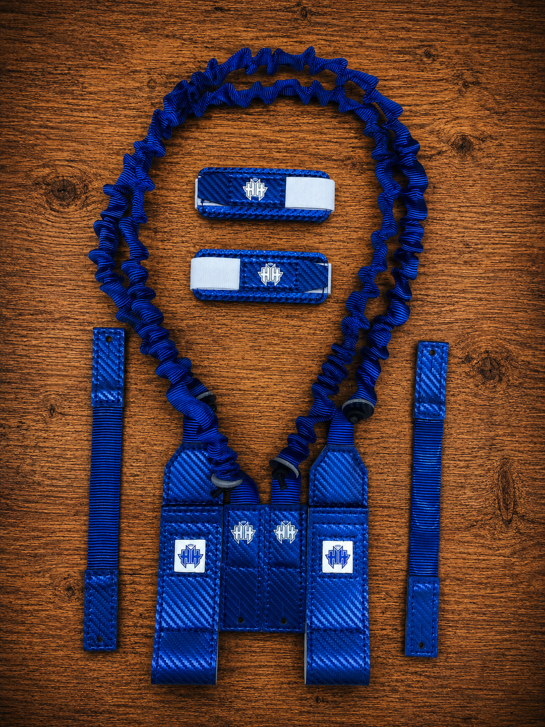 Overview shot of blue Halo Hockey Suspenders 2.0 goalie bungee suspenders shown with shoulder floater attachment option